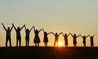 Group of people at sunset